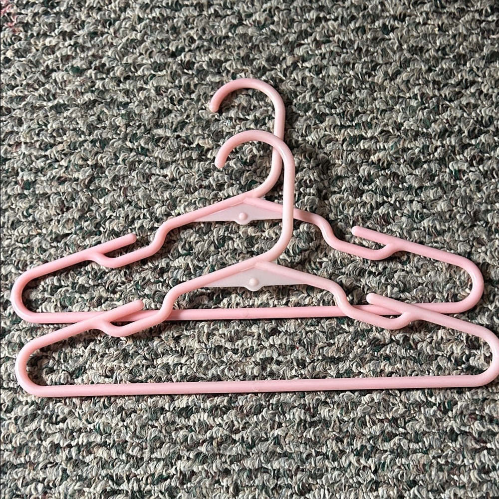 Set of Pink Plastic Hangers